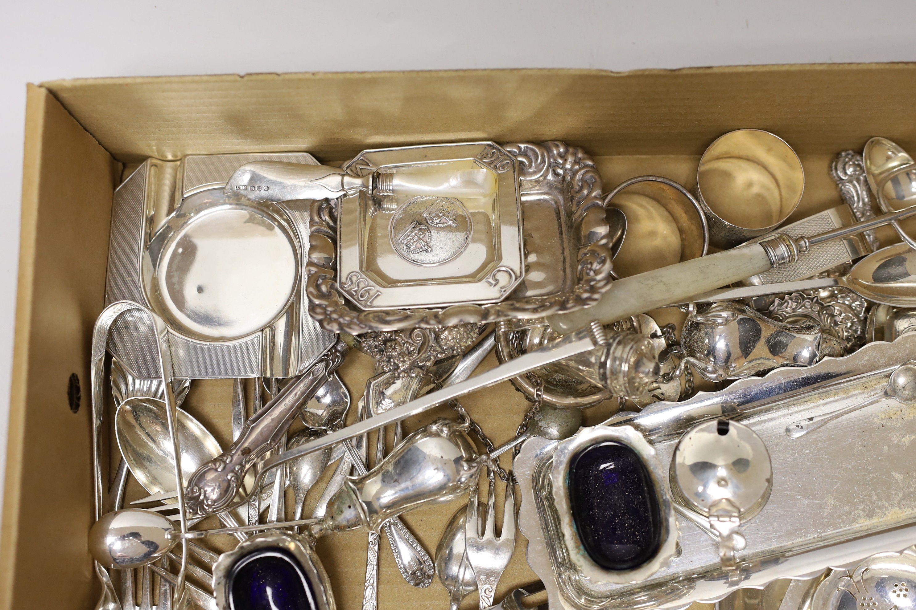 Sundry small silver wares including a cigarette case, two tea strainers, assorted flatware and a condiment set.